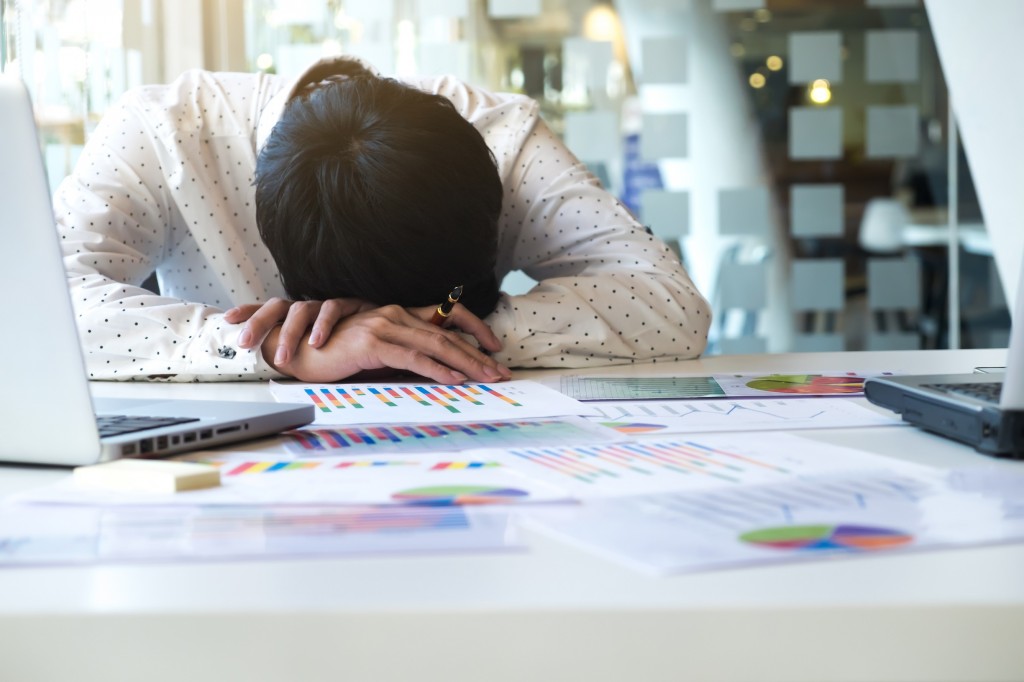 Tired overworked businessman sleeping