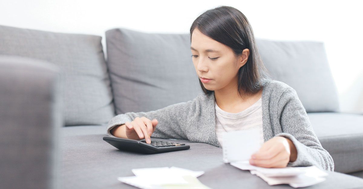 A woman computing her finances