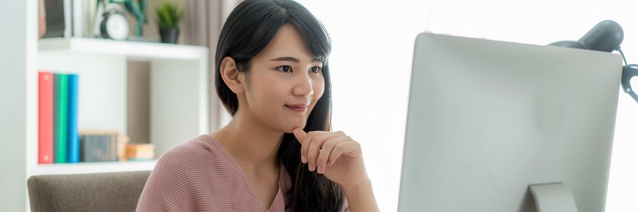 asian woman working from home