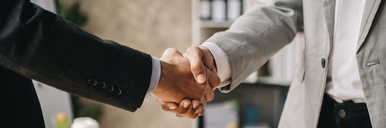 two men in a handshake