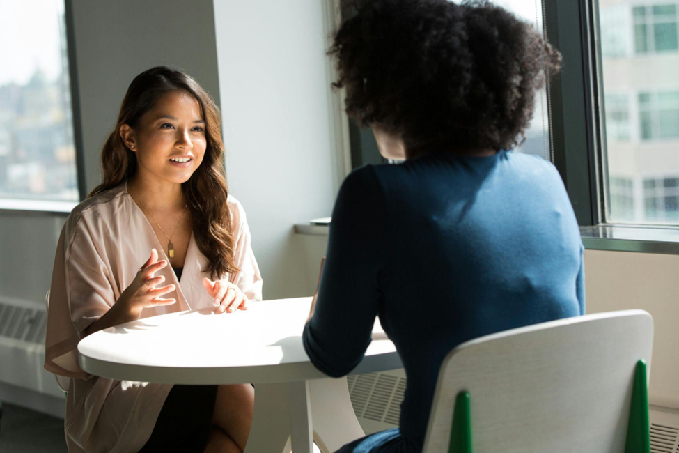 A young woman seeking help from a counsellor to help overcome her imposter syndrome