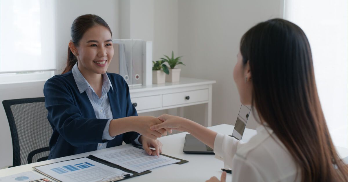 Woman being interviewed with great resume