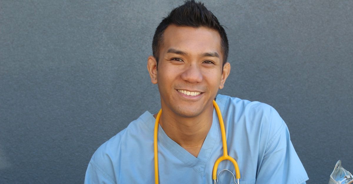 Male nurse in blue scrubs