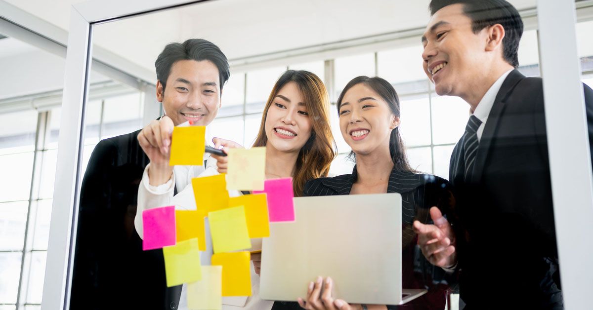 Team of professionals collaborating in a meeting, sharing ideas and working together